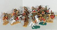 Front view of the Timpo Roman cavalry figurines arranged in a line, showing variety of poses and colors.
