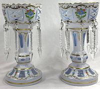 Front view of both girandoles showing overall design and hanging crystal prisms