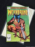 Front cover of Wolverine Limited Series comic book issue 4, showing character crouched with claws and lit cigar.