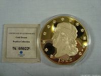 Front of coin and certificate of authenticity showing the certificate text and coin obverse.