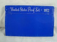 Blue cardboard outer packaging of 1972 United States Proof Set showing some wear.
