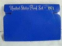Blue sealed US Mint envelope with white text reading 'United States Proof Set 1971'. Shows original packaging in lightly worn condition.