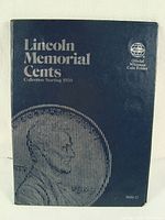 Photo of Whitman Lincoln Memorial cent folder cover showing title and design with Lincoln penny image