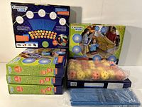 Seven boxes of Discovery Kids 72-piece construction fort sets, including rods and connector balls, displayed on a white surface.