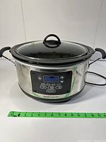 Front view of the Hamilton Beach slow cooker showing digital control panel and power cord.