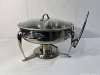 Front and side view of stainless steel chafing dish with glass lid and side handles