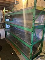 Side view of full rack showing four shelf levels and overall structure