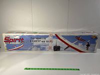 Photos of the original box packaging for the Spirit 2m sailplane RC model, showing branding and instructions.