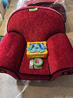 Red Blue's Clues thinking chair with toy box and CD on seat, front view.