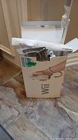 Original Nintendo Wii box with accessories and games inside in unknown condition