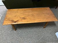 Top view of the antique pine coffee table showing wood grain and size.