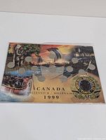 Front view of display card for 12 Canadian quarters, featuring color artwork with historic Northwest Mounted Police theme and Canada 1999 Millennium text.