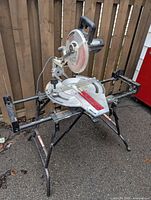 Delta Sidekick 10" sliding compound mitre saw mounted on folding stand