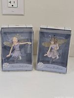 Two Hallmark Frostlight Faeries Collection ornaments in original packaging, slight box wear visible