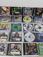 Front view of 20 PS1 game cases and discs displayed in rows showing titles and disc labels.