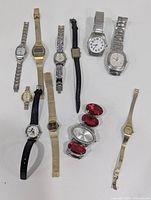 Full lot image showing all 10 watches varied in styles, strap materials, and brands arranged in rows on white background.