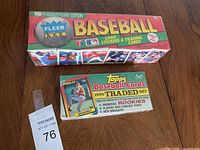 Overview of two sealed boxes: Fleer 10th Anniversary Edition and Topps 1990 Traded Set.