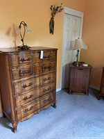Tall chest of drawers positioned in bedroom