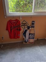 Jersey, Bud Ice penguin sign, Beware the Penguins sign all grouped by wall under window