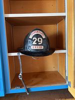 Full front view of helmet on shelf