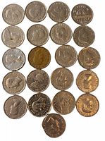 Top view of 21 Canadian nickels with beaver and monarch designs, showing all items in the lot with varying wear and shine