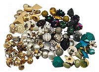 Full overview of the entire collection of vintage clip-on earrings showing a variety of colors and styles including gold, silver, black, white, green, turquoise, floral, and beaded designs.