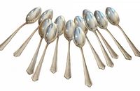 Twelve Bruckmann silver spoons arranged in fanned layout