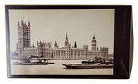 Photo of vintage cabinet card showing the Palace of Westminster and Houses of Parliament with the River Thames and a boat in front