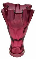 Cranberry glass vase front view showing fluted edge and tapered body in deep pink-red color.