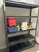 Full view of five shelf Gorilla shelf unit with items on shelves, showing size and condition.