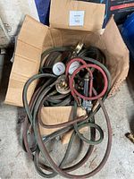 View of the regulator and hoses inside cardboard box