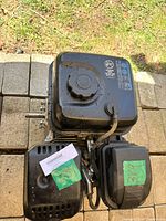 Top view of the Homelite gas engine showing fuel tank and pull start cover with green sticker labeled 338.