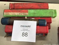 Multiple drill bit and tool cases from Carlson-Osborn, SKF & Dormer, Cleveland, Easicut, and blue cylindrical cases.