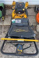 Top-down view showing handlebar, deck top, engine cover and front guard