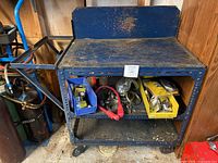 Work cart filled with various electrical parts and tools.