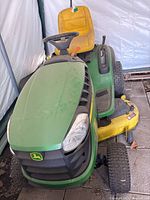 Front view showing hood, headlights, front tires, and hood grille