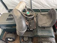 Side view of Craftsman riding lawnmower with Kohler engine and mower deck attachment, showing general condition and mower components.