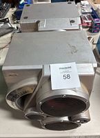 Top and side view of the Aiwa speaker system showing the silver casing and ventilation slits.