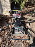Craftsman 5.5 HP self-propelled lawn mower showing front view with engine and wheels visible