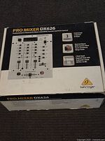 Box for Behringer Pro Mixer DX626 showing product information and branding