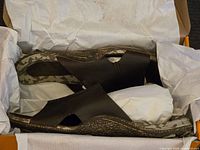 Side and top views of brand new Cushe sandals in original box with white tissue paper wrapping