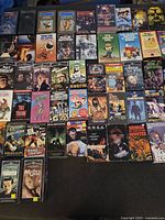 Full spread of most VHS tapes showing a variety of classic horror, monster movies, and animation titles.