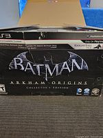 Damaged outer box featuring PS3 and Batman Arkham Origins collector's edition branding.