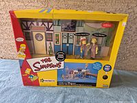 Front angle of the sealed boxed set showing main characters and box artwork