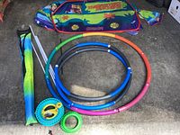Image showing all items including the three hula hoops in green, blue, gray, and orange/pink colors, kite bag with blue and green colors, and Scooby Doo play fort folded down.
