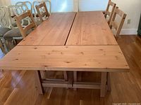 Front view of extended table with chairs