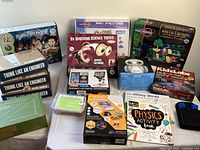 Full lot overview showing all kits and books arranged on a table.