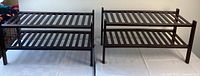 Two wooden shoe racks side by side showing the full profile of both racks and their slatted design.