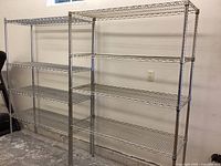 Two shelving units side by side against a white wall showing overall size and configuration