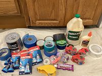 Full overview of all items - tapes, glues, dispensers, and household adhesive tube